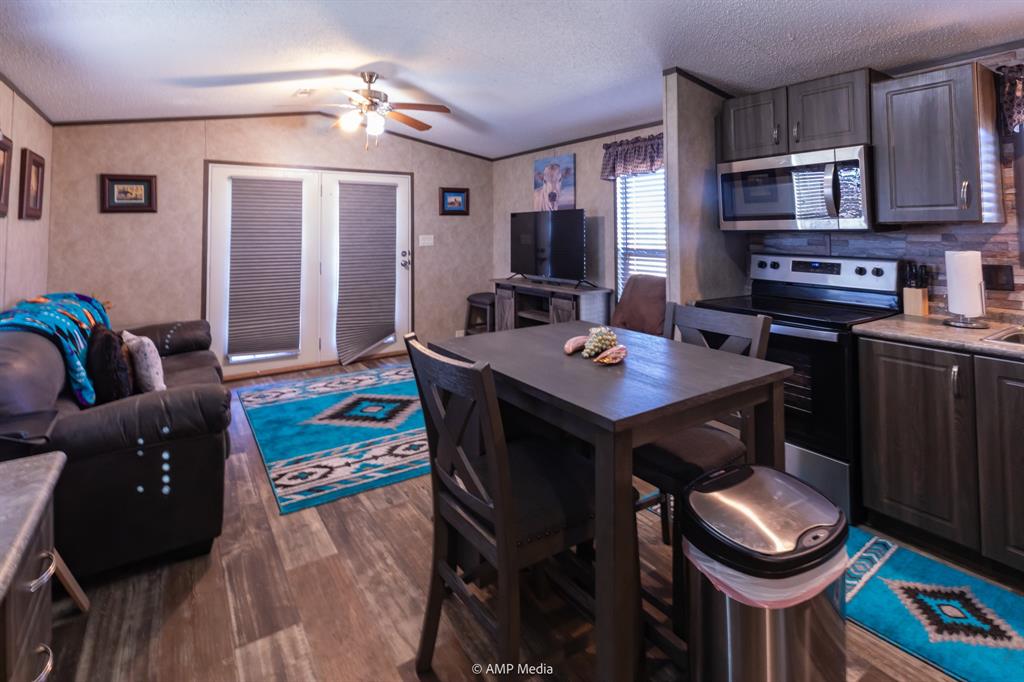 159 Adams Rule, TX 79548 - Photo 4 of 13 a view of a dining room with furniture and wooden floor