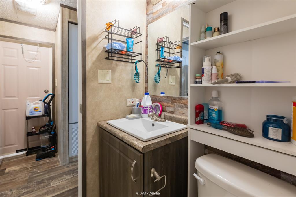 159 Adams Rule, TX 79548 - Photo 10 of 13 a bathroom with a sink vanity and a mirror