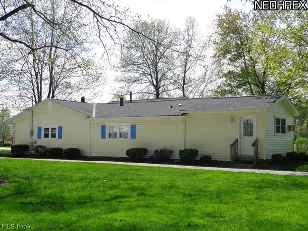 36490 Aurensen Road North Ridgeville, OH 44039 - Photo 24 of 24 A view of the East side of the home. The door accesses the Master Suite addition.