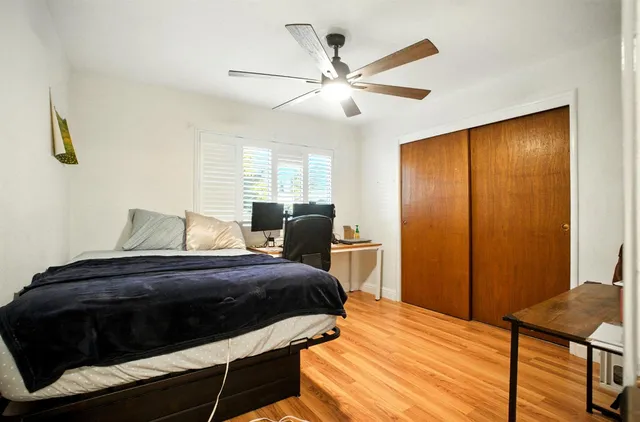 a bedroom with a bed and a dresser