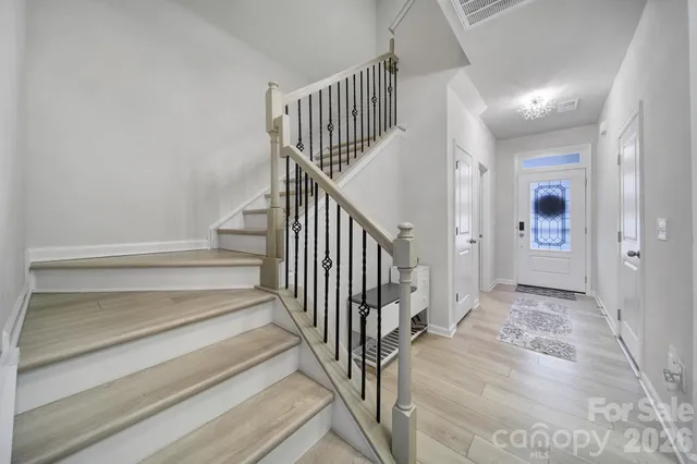 a view of staircase with white walls and white walls