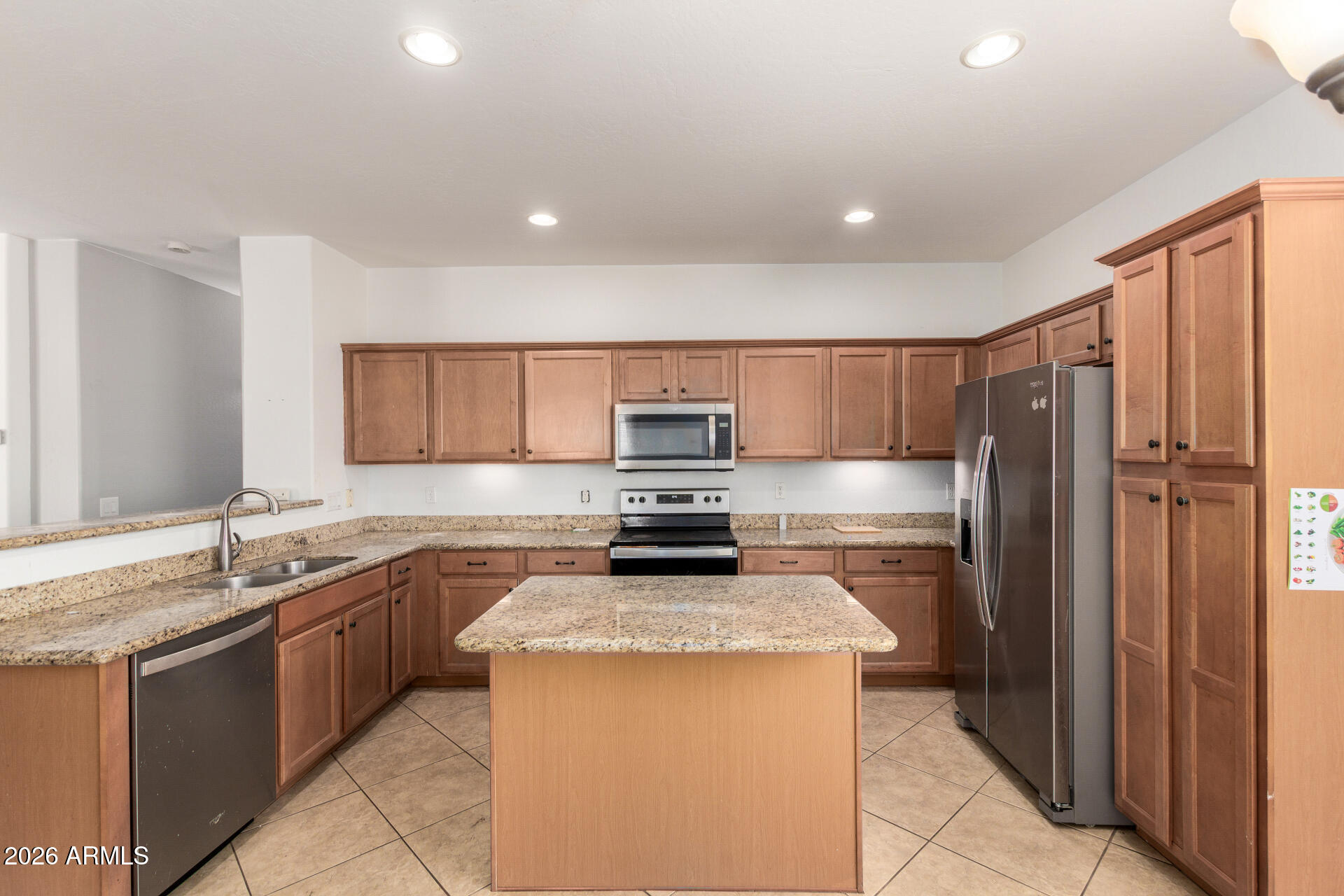 15339 West Jackson Street Goodyear, AZ 85338 - Photo 11 of 36 a kitchen with a sink stove and refrigerator