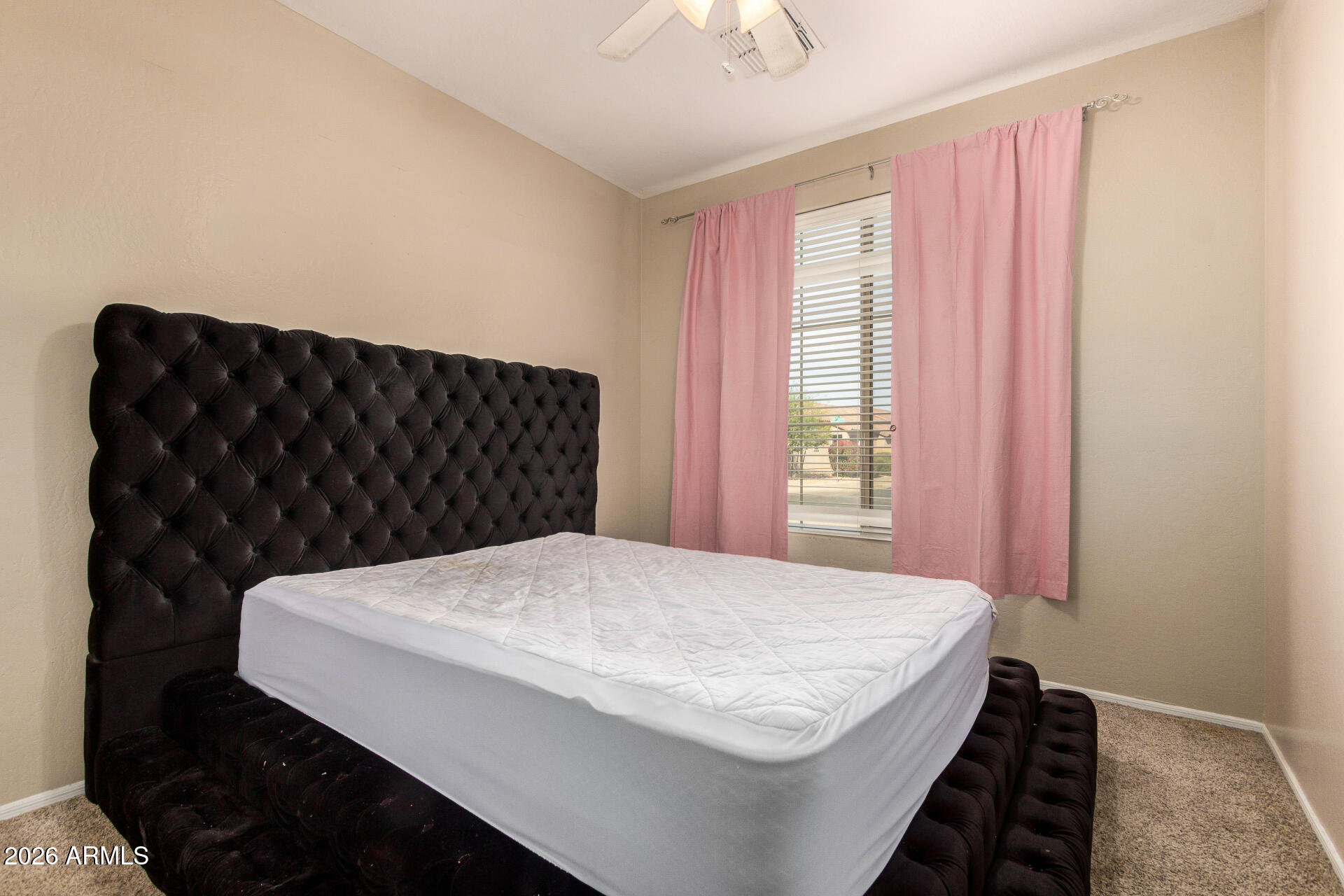 15339 West Jackson Street Goodyear, AZ 85338 - Photo 23 of 36 a close up of a bed