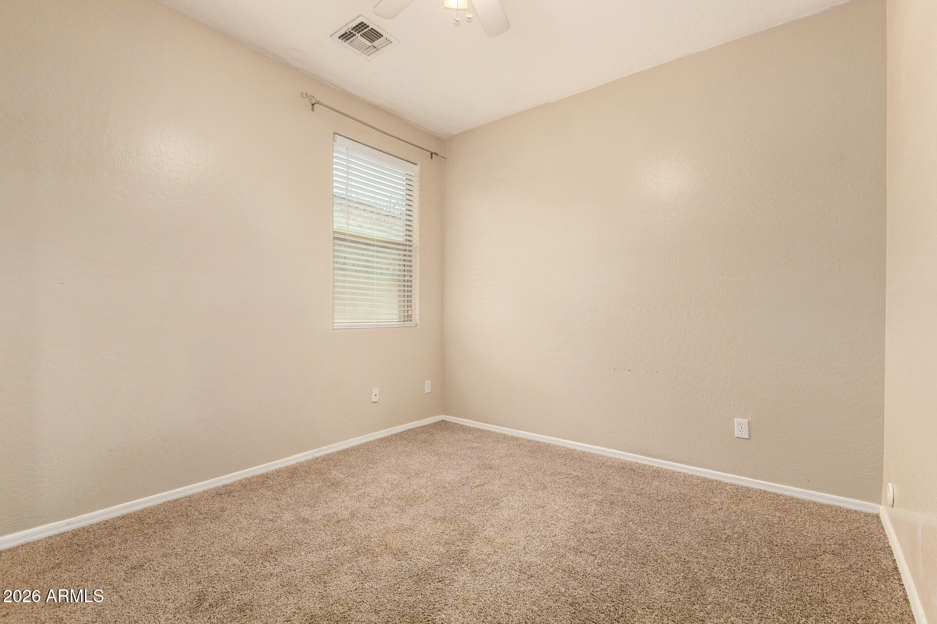 15339 West Jackson Street Goodyear, AZ 85338 - Photo 25 of 36 an empty room with windows and closet
