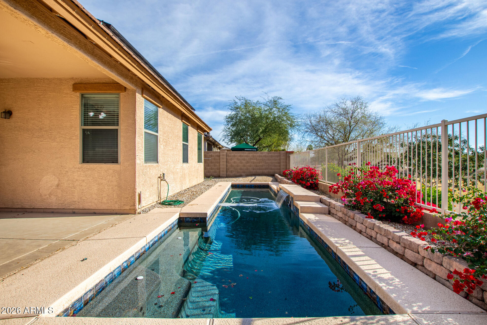 15339 West Jackson Street Goodyear, AZ 85338 - Photo 31 of 36 a view of house with a yard and potted plants