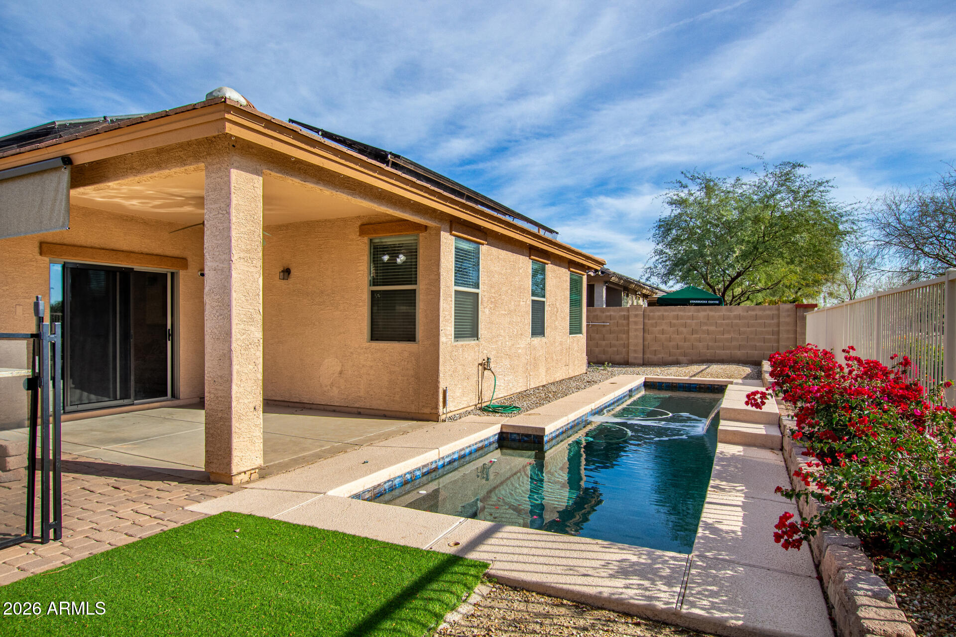 15339 West Jackson Street Goodyear, AZ 85338 - Photo 33 of 36 a front view of a house with garden
