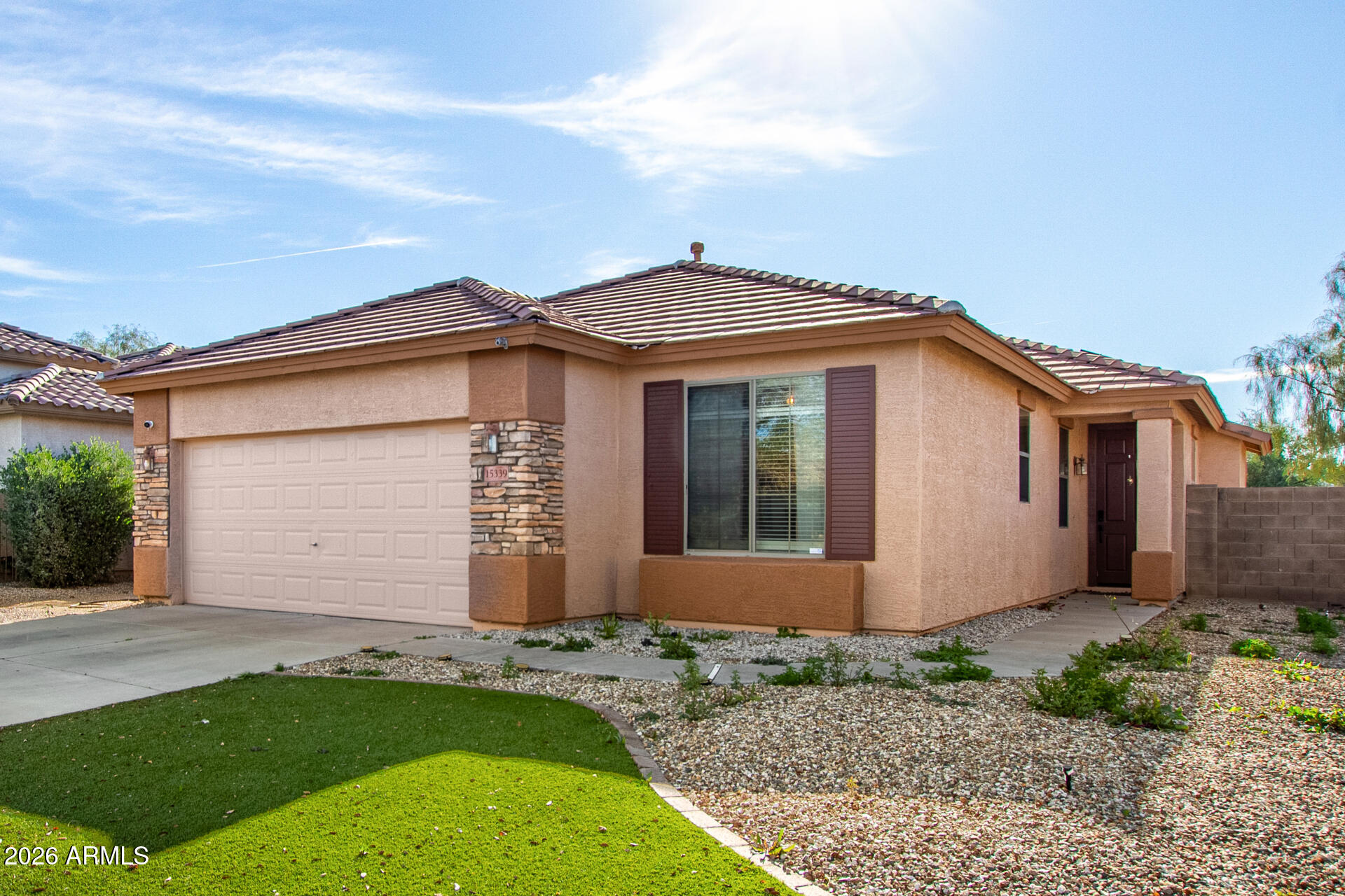 15339 West Jackson Street Goodyear, AZ 85338 - Photo 6 of 36 a view of a house with a yard