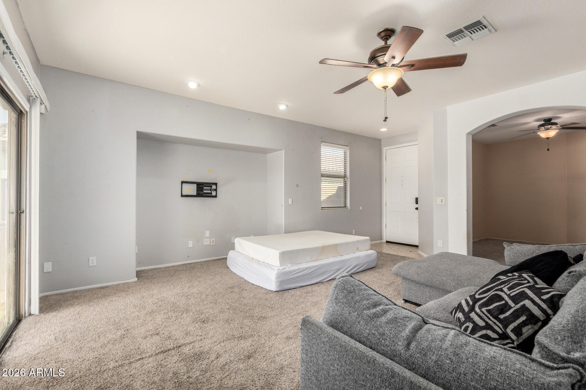 15339 West Jackson Street Goodyear, AZ 85338 - Photo 9 of 36 a bedroom with a bed and window