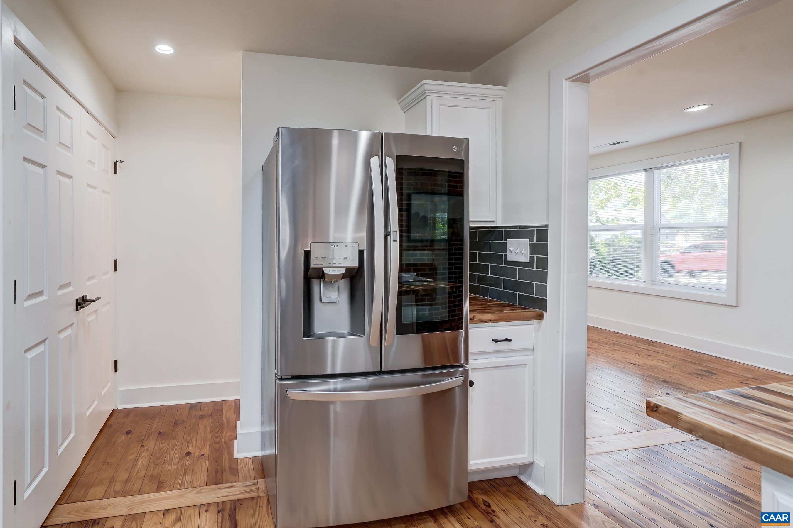 1407 Florence Road Charlottesville, VA 22902 - Photo 15 of 37 a kitchen with stainless steel appliances a refrigerator stove and cabinets