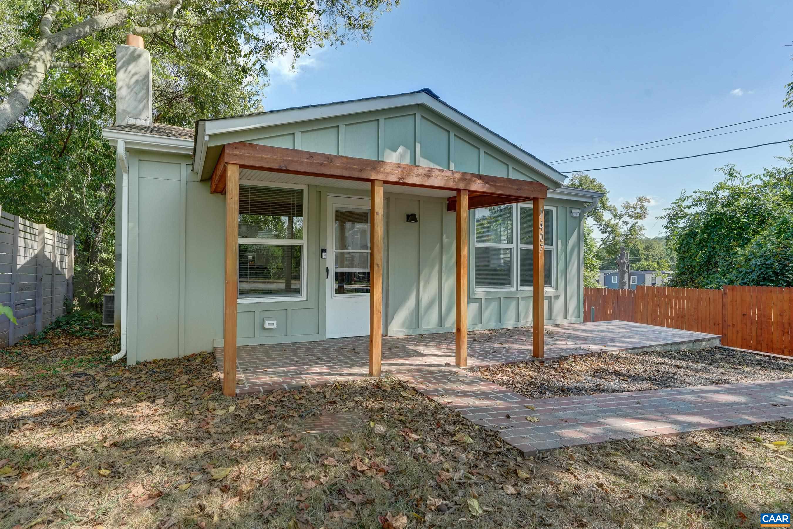 1407 Florence Road Charlottesville, VA 22902 - Photo 2 of 37 a front view of a house with a garden