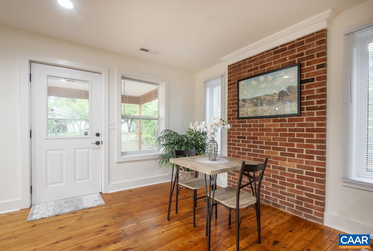 1407 Florence Road Charlottesville, VA 22902 - Photo 6 of 37 a view of a dining room with furniture window and wooden floor