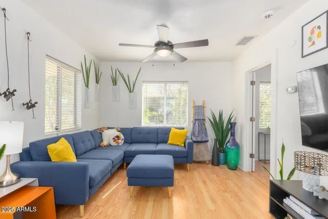 a living room with furniture and a large window