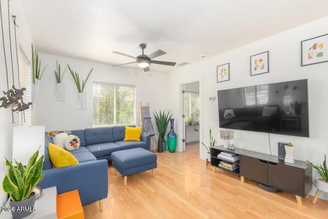 a living room with furniture and a flat screen tv