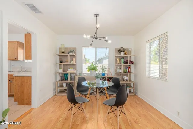 a view of a dining room with furniture window and wooden floor