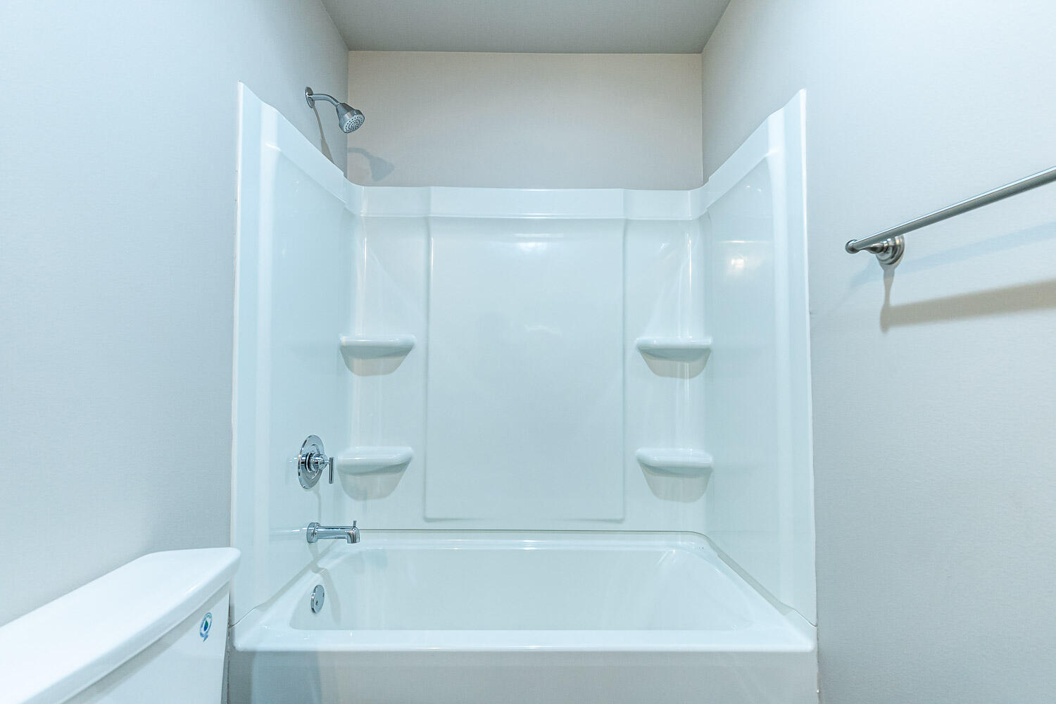 5522 122nd Street Lubbock, TX 79424 - Photo 17 of 23 a white bath tub sitting next to a white toilet