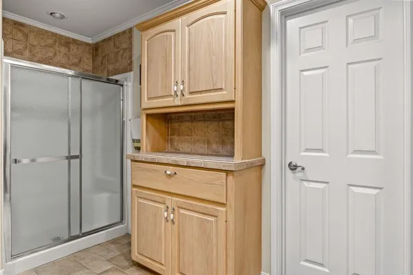 a close view of a refrigerator and cabinet in a kitchen
