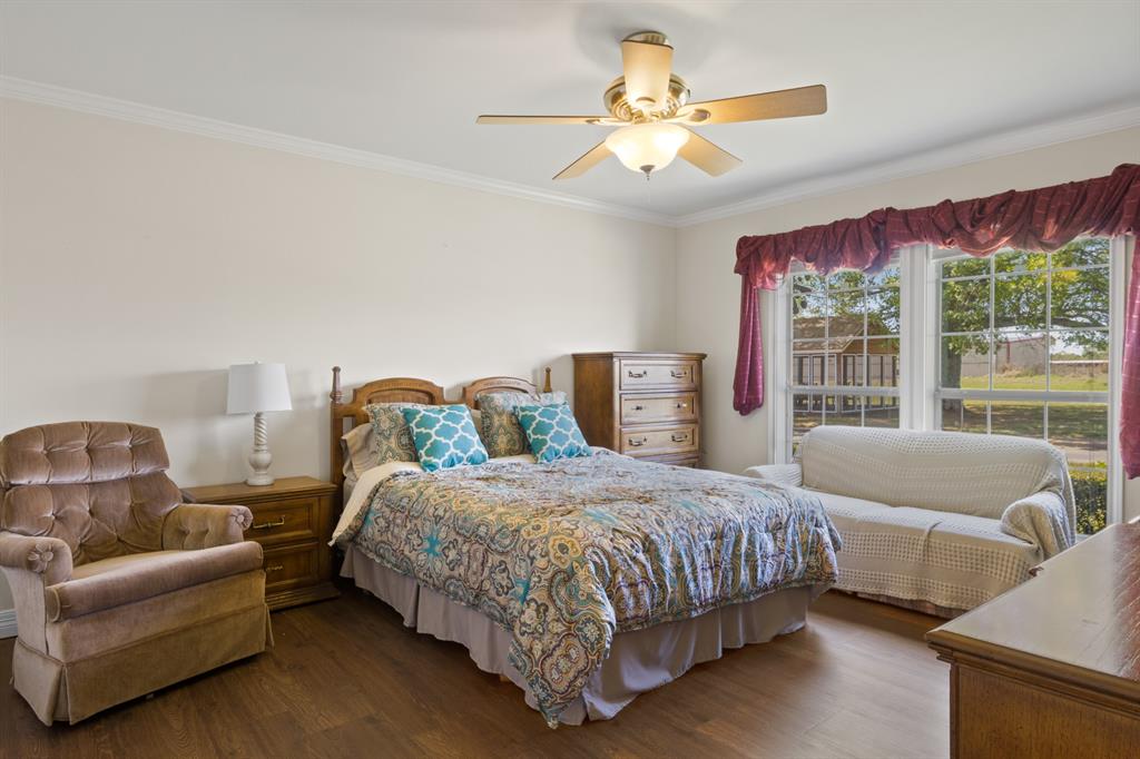 204 Pvt Road Mount Pleasant, TX 75455 - Photo 14 of 26 a bedroom with a bed couch and window