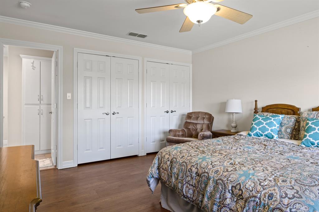 204 Pvt Road Mount Pleasant, TX 75455 - Photo 15 of 26 a bedroom with two beds and a chandelier