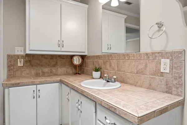 a bathroom with a sink and vanity