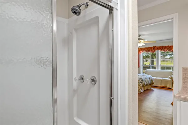 a view of a bedroom from a corridor