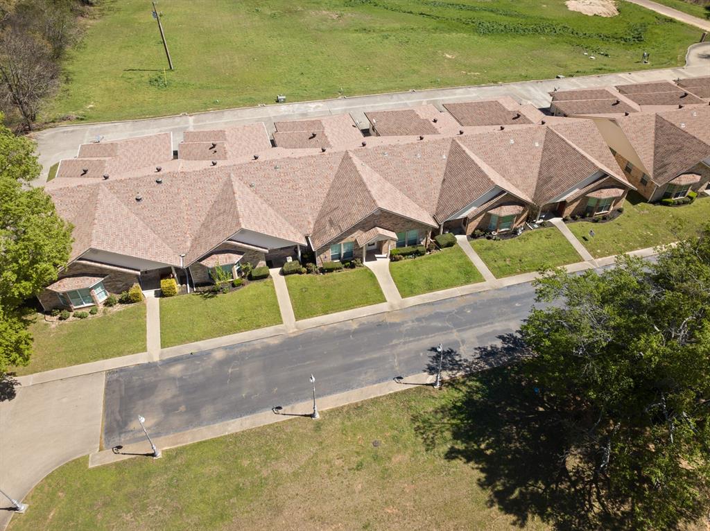 204 Pvt Road Mount Pleasant, TX 75455 - Photo 24 of 26 an aerial view of a house with a yard and greenery