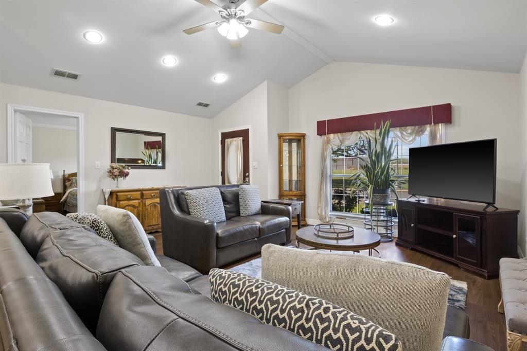 204 Pvt Road Mount Pleasant, TX 75455 - Photo 3 of 26 a living room with furniture a large window and a flat screen tv