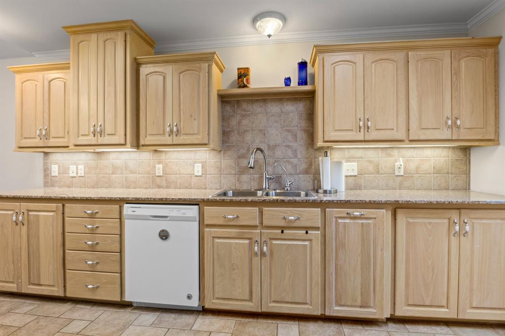 204 Pvt Road Mount Pleasant, TX 75455 - Photo 7 of 26 a kitchen with granite countertop cabinets and sink