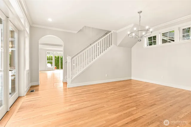 a view of an entryway with wooden floor