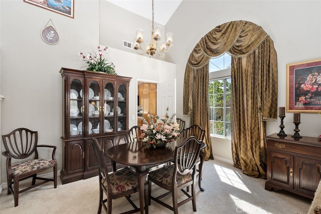 305 Mission Grove Parkway North Riverside, CA 92506 - Photo 19 of 49 a view of a dining room with furniture and chandelier