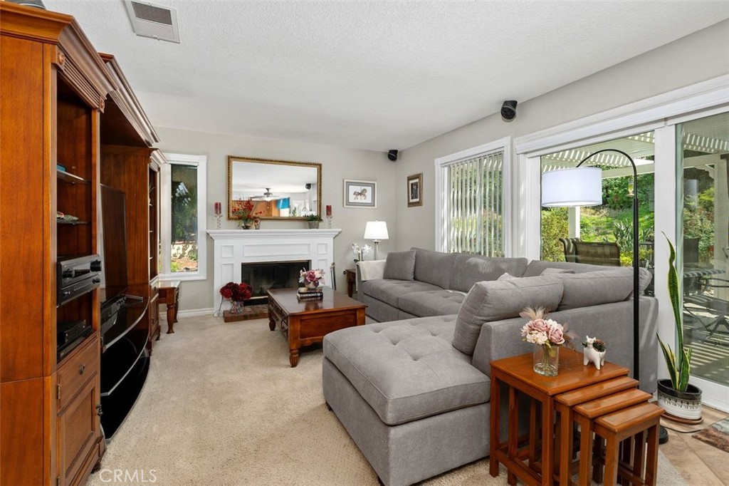 305 Mission Grove Parkway North Riverside, CA 92506 - Photo 20 of 49 a living room with furniture a flat screen tv and a fireplace