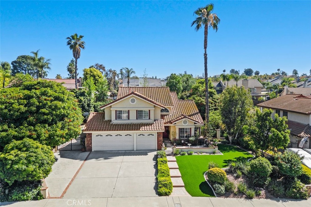305 Mission Grove Parkway North Riverside, CA 92506 - Photo 2 of 49 a front view of a house with a garden