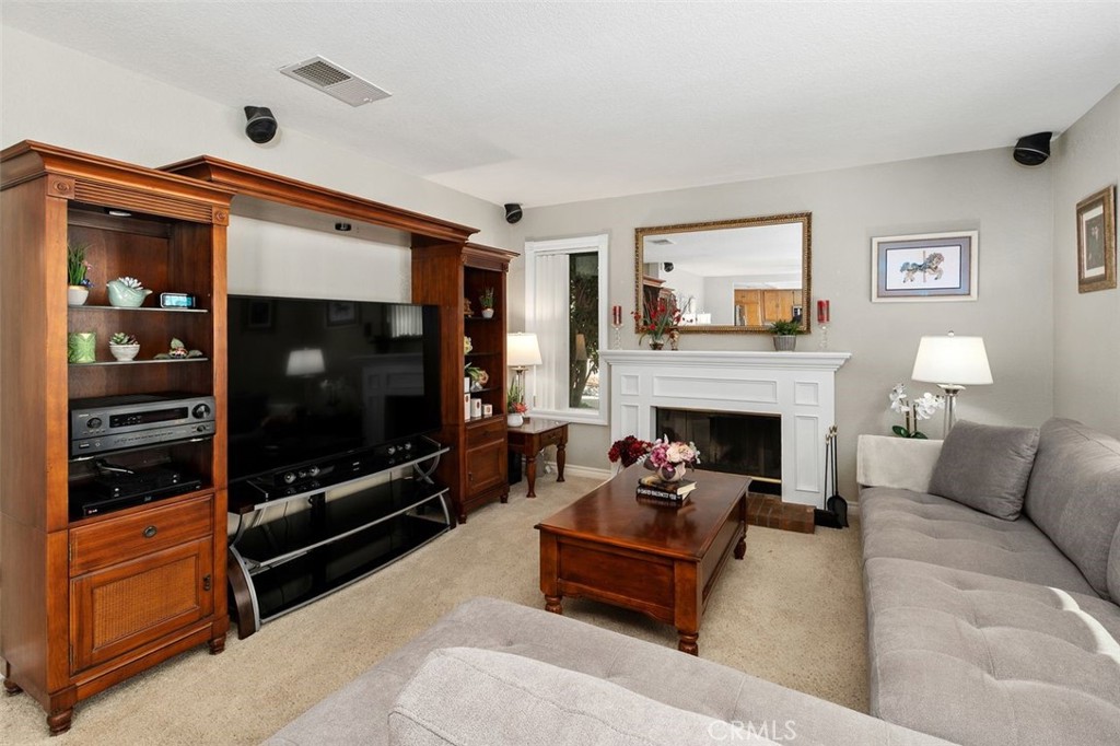 305 Mission Grove Parkway North Riverside, CA 92506 - Photo 21 of 49 a living room with furniture a flat screen tv and a fireplace