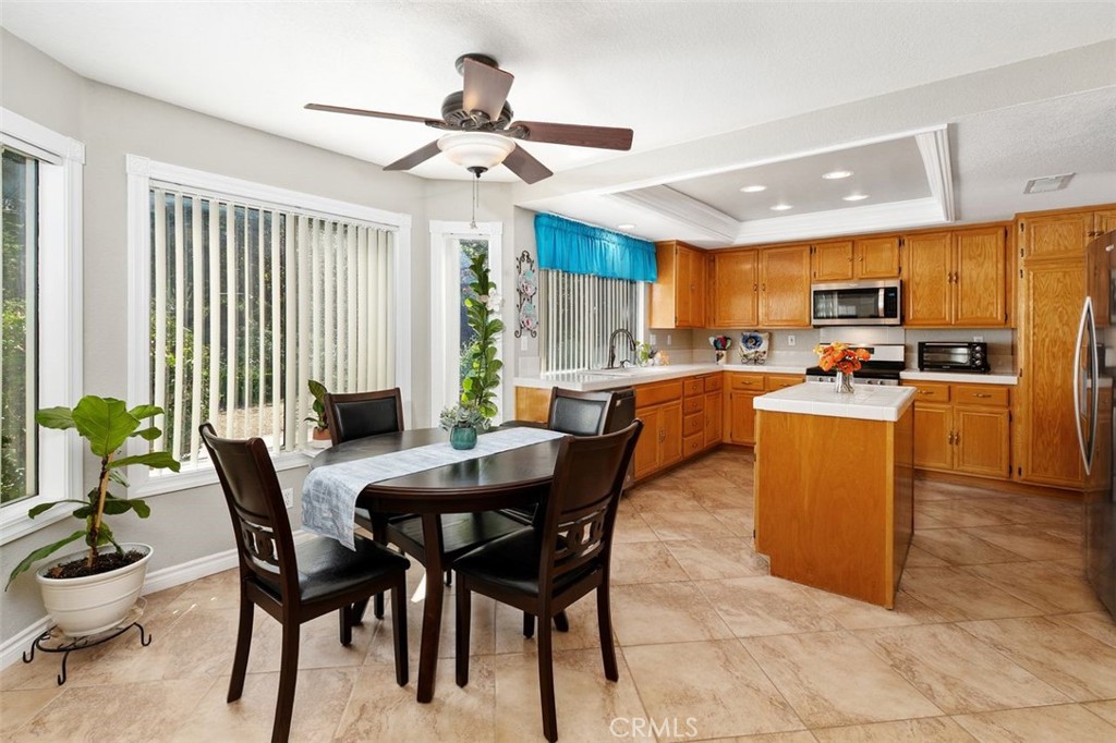 305 Mission Grove Parkway North Riverside, CA 92506 - Photo 24 of 49 a dining room with stainless steel appliances granite countertop a table and chairs