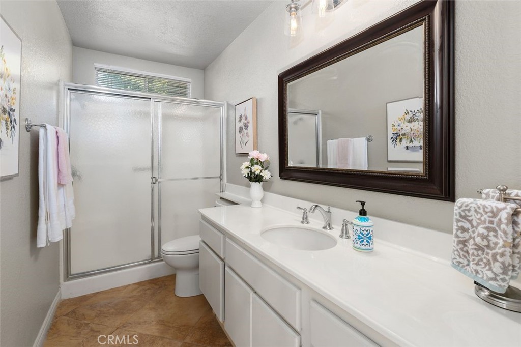 305 Mission Grove Parkway North Riverside, CA 92506 - Photo 30 of 49 a bathroom with a sink a toilet and shower
