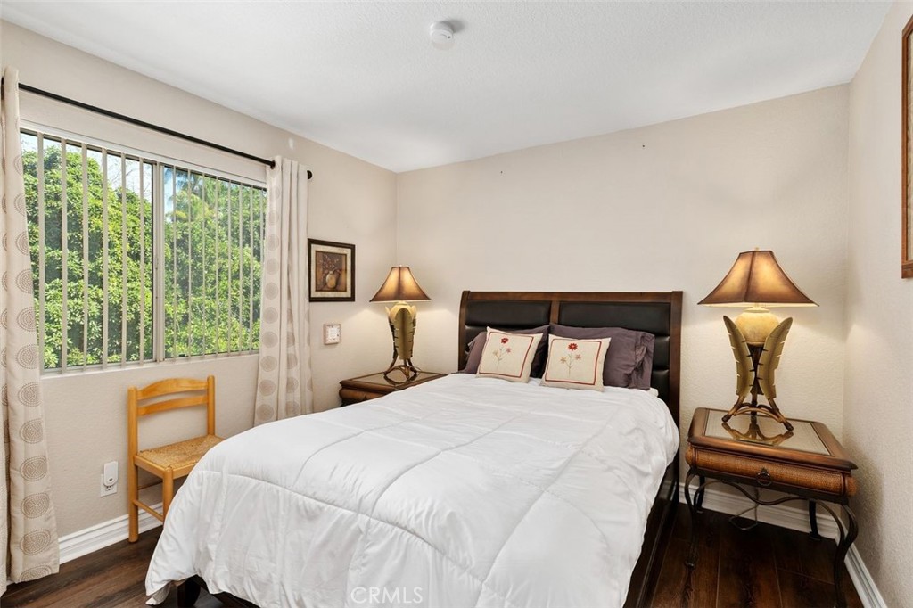 305 Mission Grove Parkway North Riverside, CA 92506 - Photo 35 of 49 a bedroom with a bed and a table