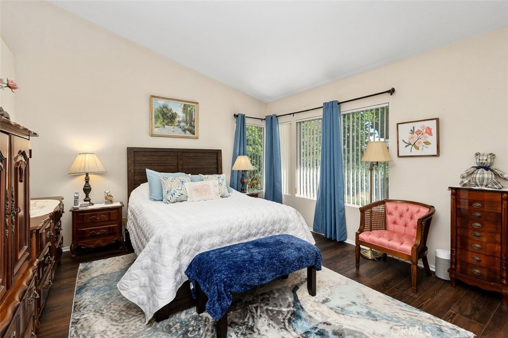 305 Mission Grove Parkway North Riverside, CA 92506 - Photo 37 of 49 a bedroom with bed and wooden floor