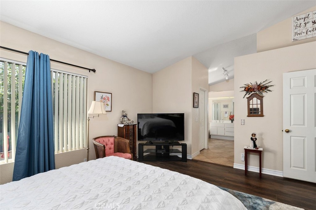 305 Mission Grove Parkway North Riverside, CA 92506 - Photo 38 of 49 a bedroom with a bed and a flat screen tv