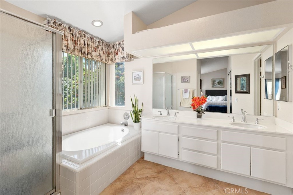 305 Mission Grove Parkway North Riverside, CA 92506 - Photo 39 of 49 a bathroom with a tub a sink and mirror