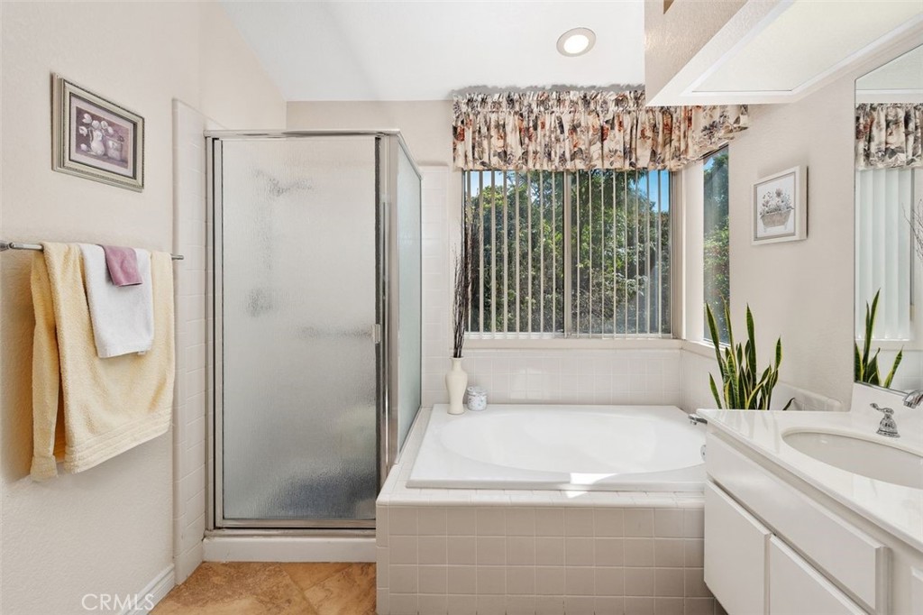 305 Mission Grove Parkway North Riverside, CA 92506 - Photo 40 of 49 a bathroom with a bathtub and a shower