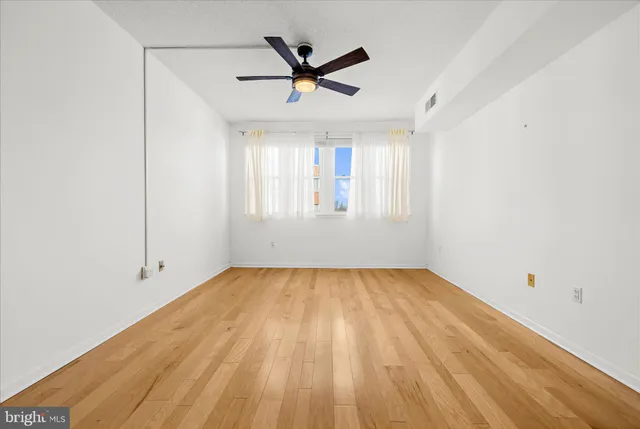 a bathroom with a granite countertop bathtub and sink