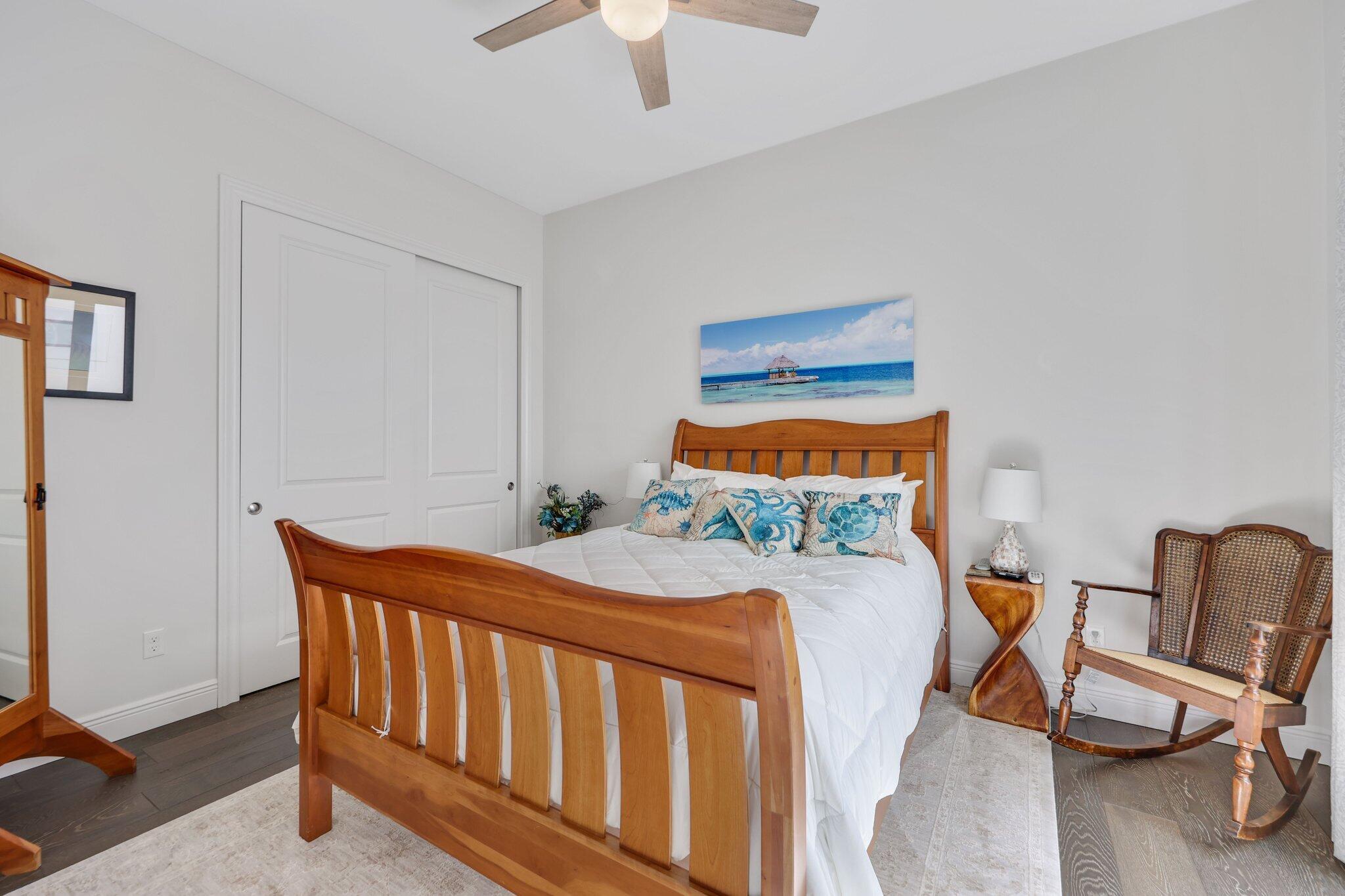 2530 Northwest 71st Street Boca Raton, FL 33496 - Photo 44 of 94 a bedroom with a bed and a chair