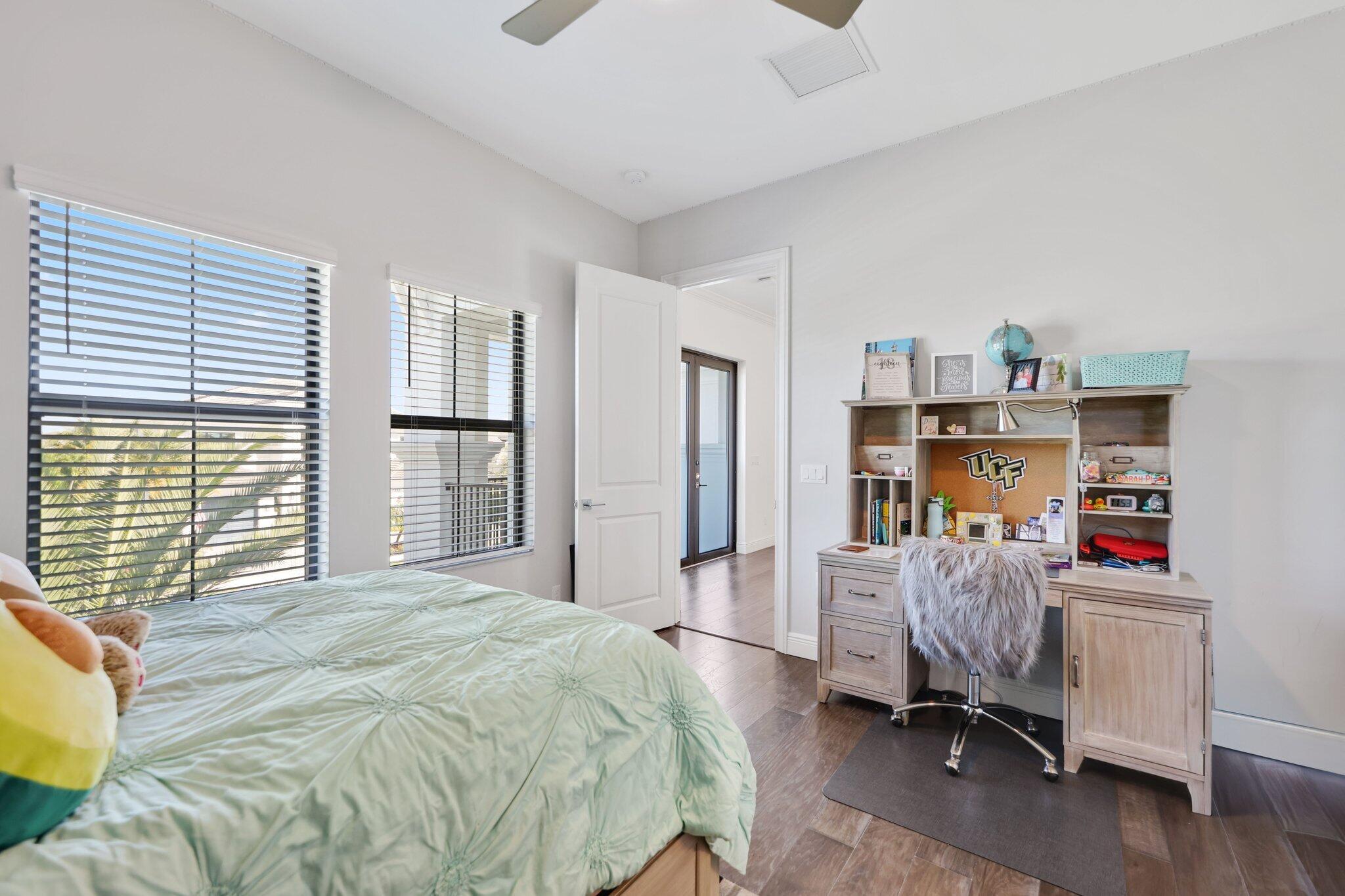 2530 Northwest 71st Street Boca Raton, FL 33496 - Photo 48 of 94 a bedroom with a bed furniture and a window