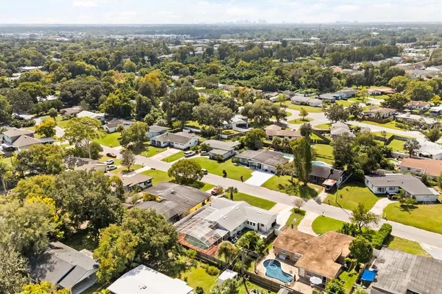 an aerial view of residential houses with outdoor space