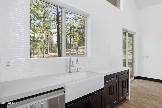 a kitchen with a sink and a window