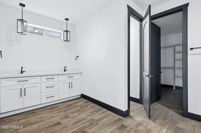 a spacious bathroom with a shower and a sink
