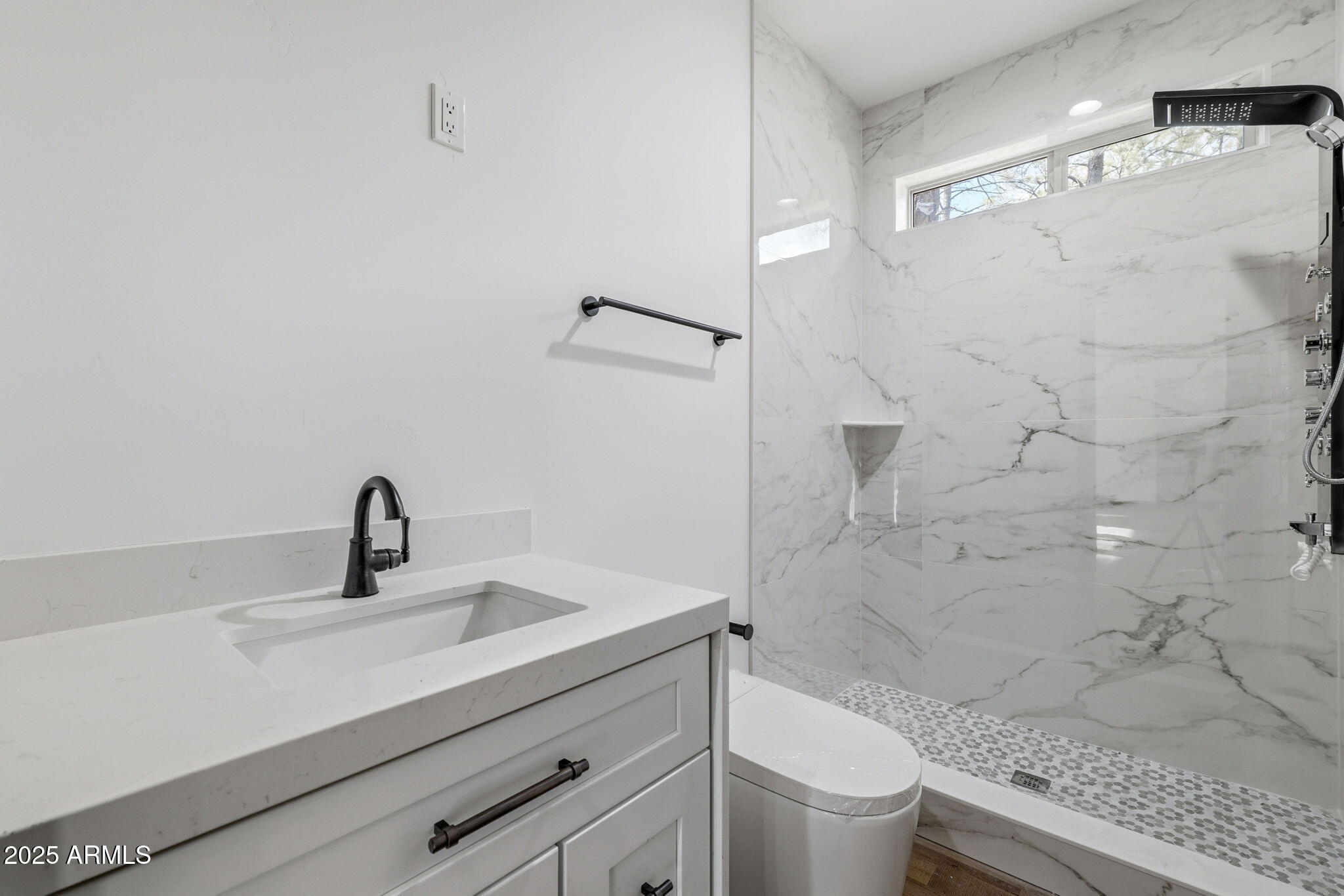 2400 West Bench Road Show Low, AZ 85901 - Photo 20 of 37 a bathroom with a sink a toilet and shower