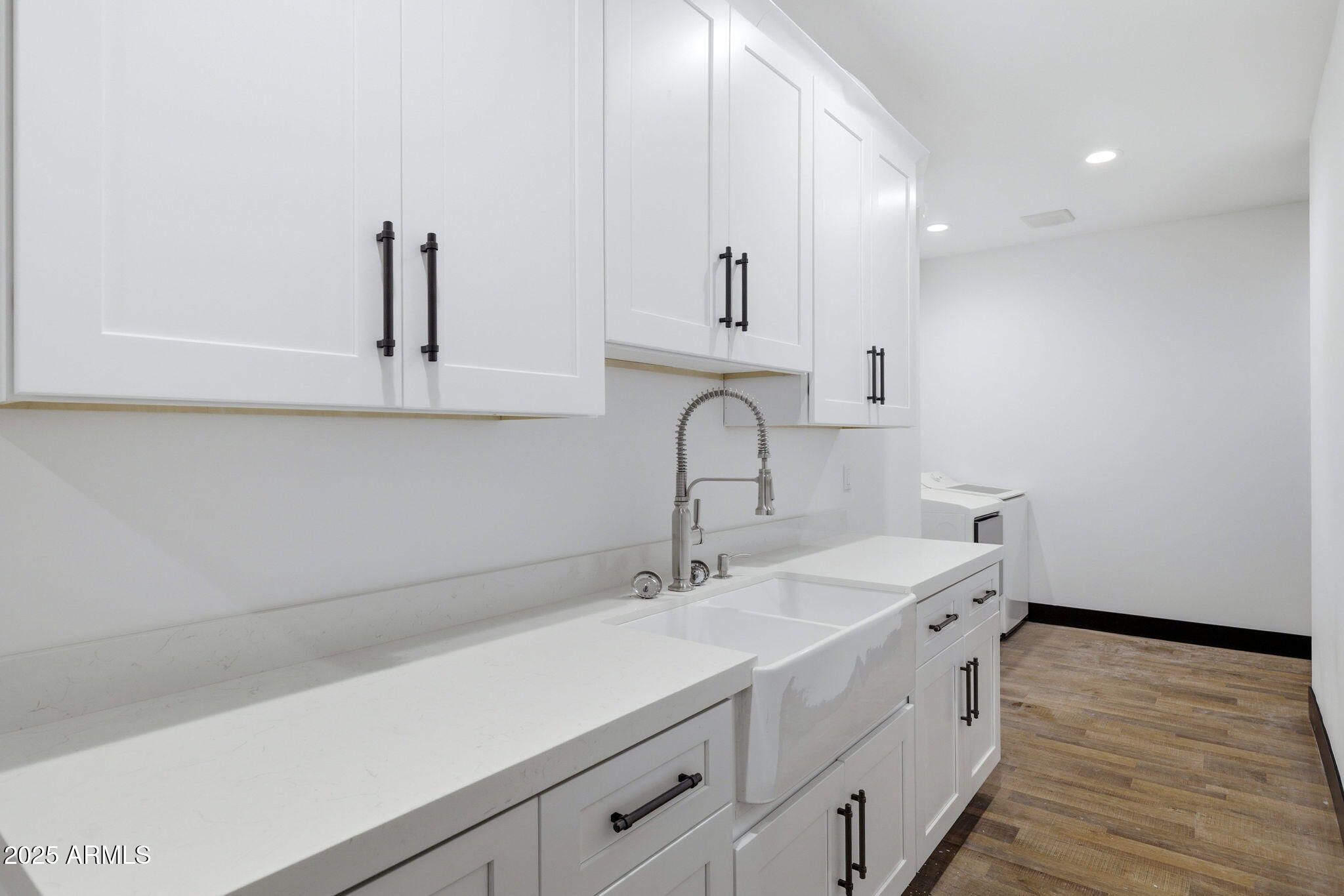 2400 West Bench Road Show Low, AZ 85901 - Photo 22 of 37 a kitchen with a sink cabinets and wooden floor
