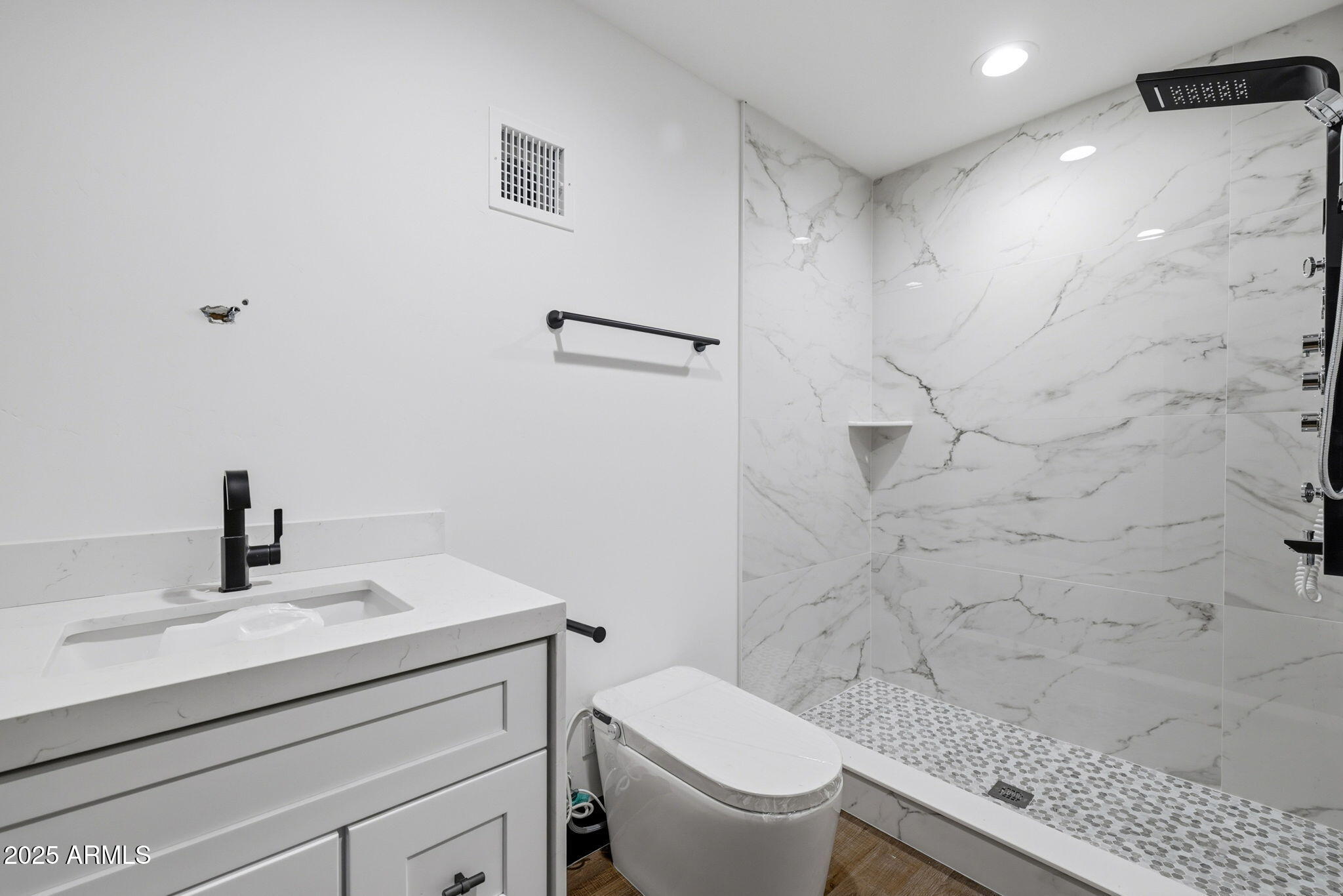2400 West Bench Road Show Low, AZ 85901 - Photo 25 of 37 a bathroom with a granite countertop toilet sink and mirror