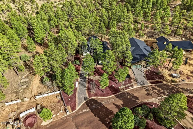 an outdoor space with furniture and garden