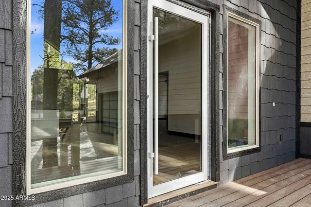a glass door with a glass door and shower